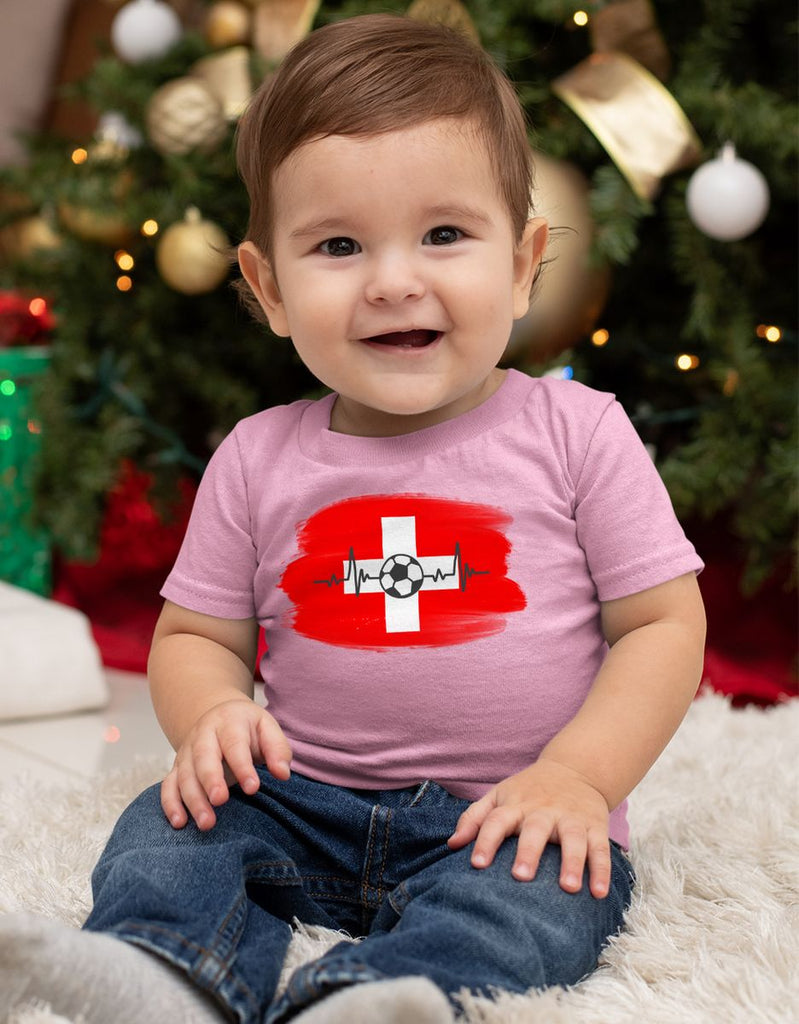 Baby / Kinder T-Shirt mit Spruch Schweiz Flagge mit Fussball - von Mikalino