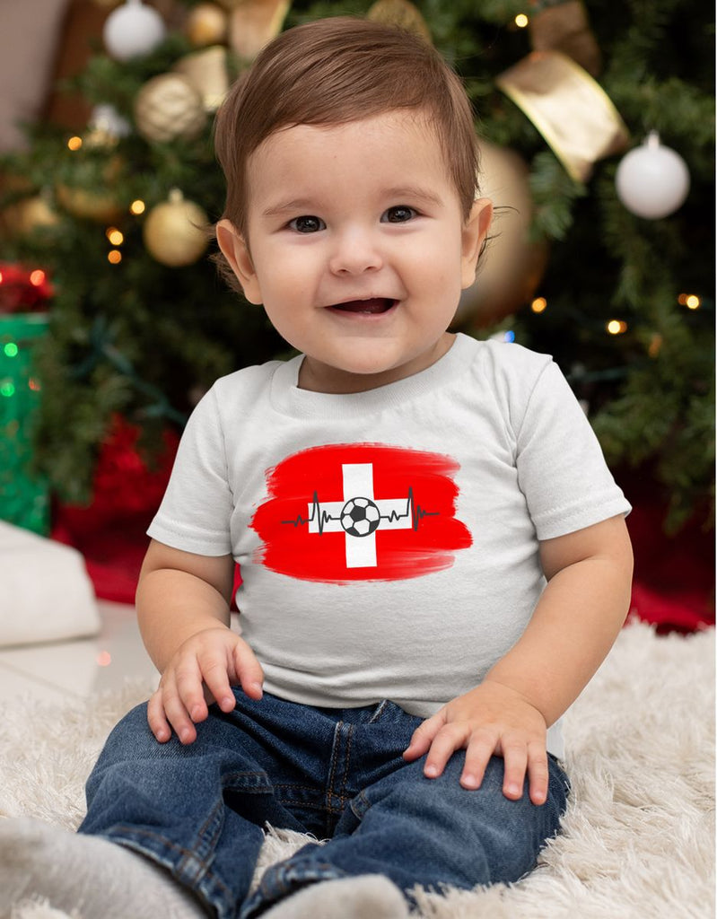 Baby / Kinder T-Shirt mit Spruch Schweiz Flagge mit Fussball - von Mikalino